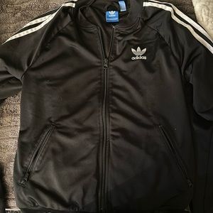 Black Adidas jacket with white stripes